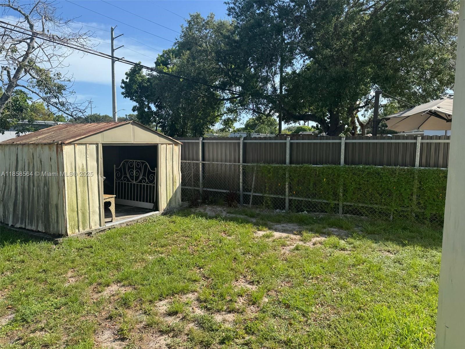 2060 Rutland Street Opa-Locka, FL 33054 - Photo 3 of 10 a backyard of a house with lots of green space