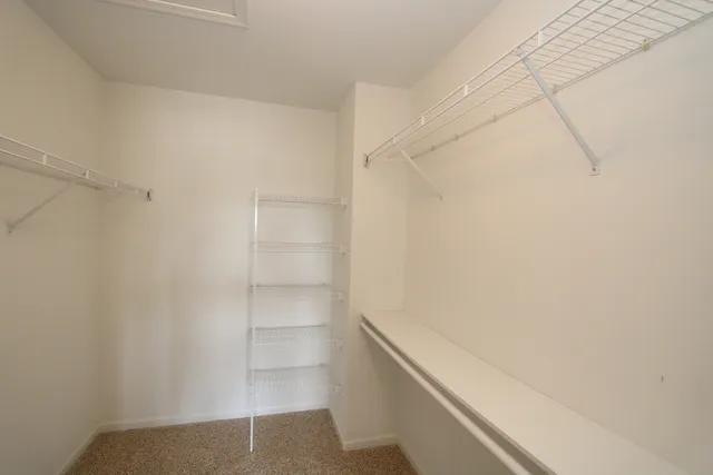 a view of an empty walk in closet