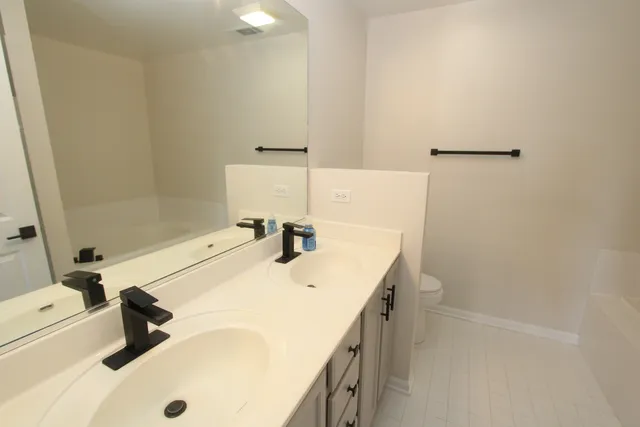 a bathroom with a sink and a shower