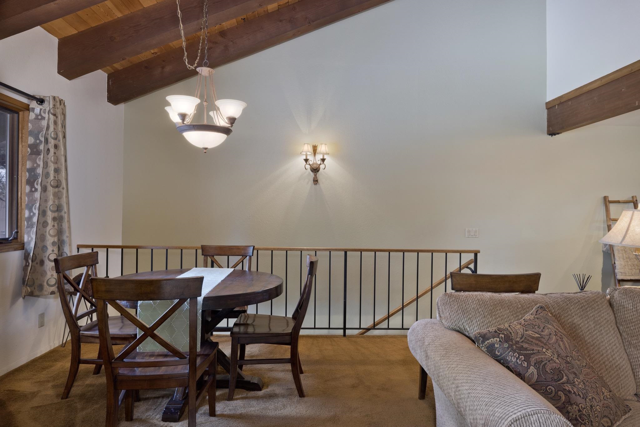 484 Manzanita Road, Unit 16 Mammoth Lakes, CA 93546 - Photo 13 of 34 a view of a balcony with furniture and a chandelier