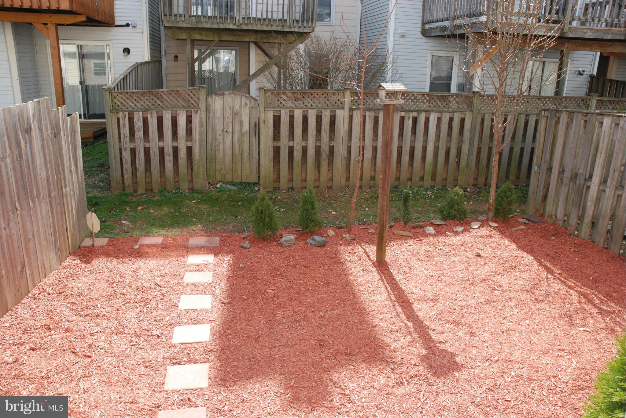 13310 Country Ridge Drive Germantown, MD 20874 - Photo 19 of 26 a view of a house with a backyard