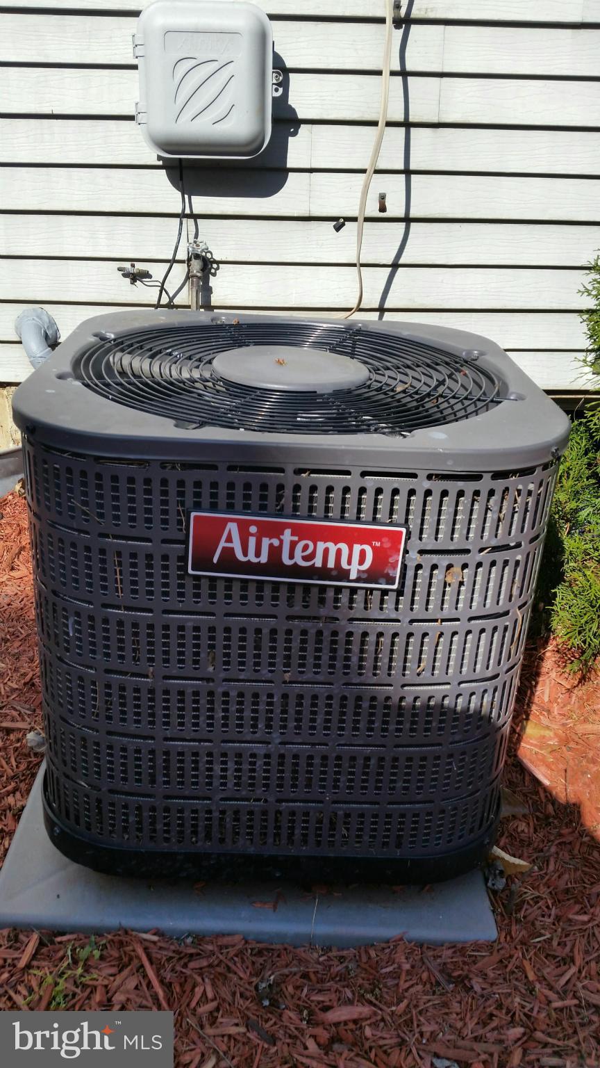 13310 Country Ridge Drive Germantown, MD 20874 - Photo 21 of 26 a view of a brick house with a roof deck