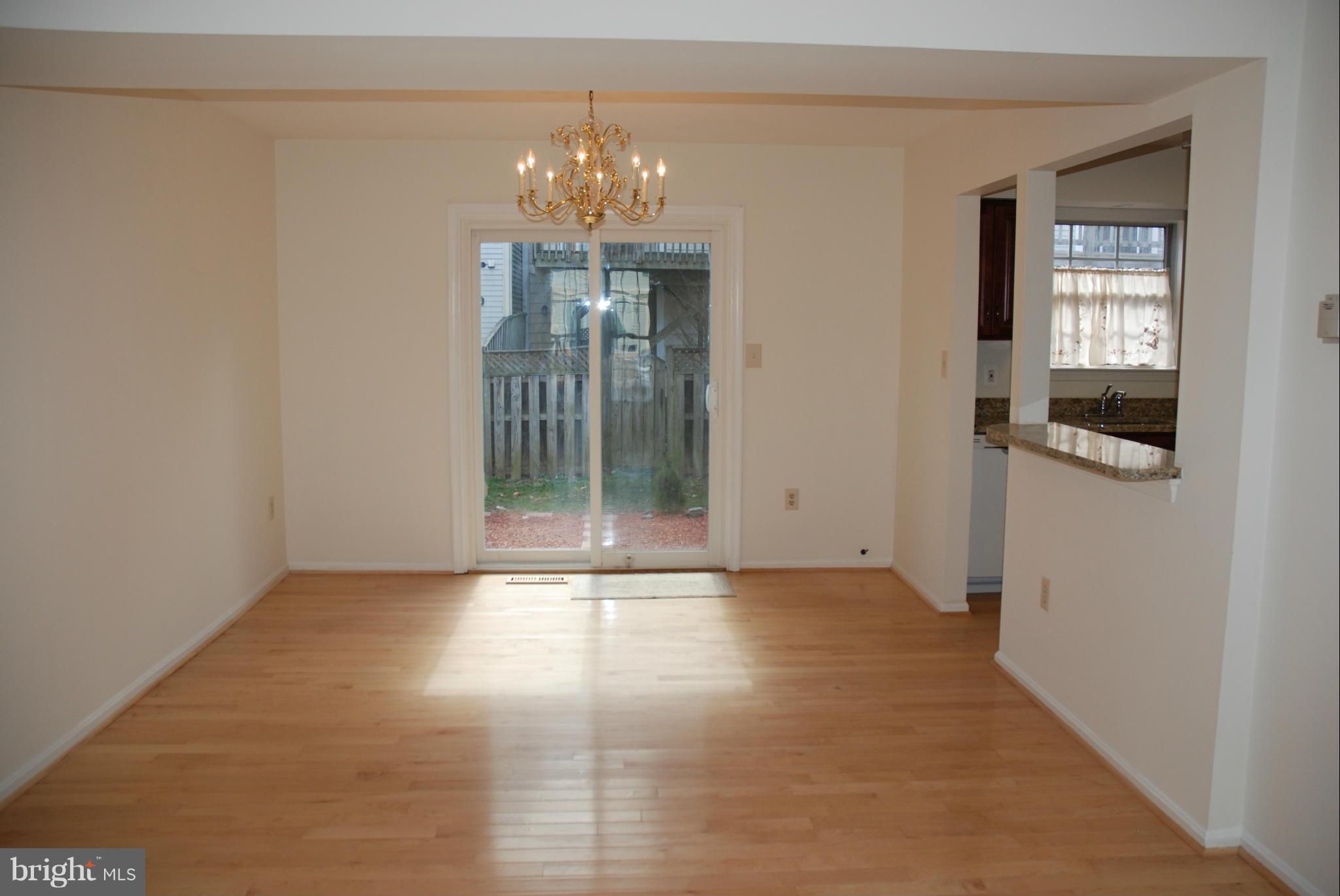 13310 Country Ridge Drive Germantown, MD 20874 - Photo 7 of 26 a view of an empty room with chandelier and window