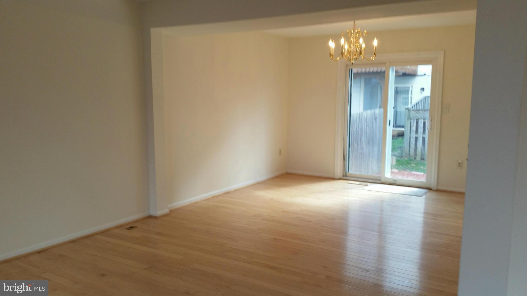13310 Country Ridge Drive Germantown, MD 20874 - Photo 9 of 26 a view of an empty room with a chandelier fan
