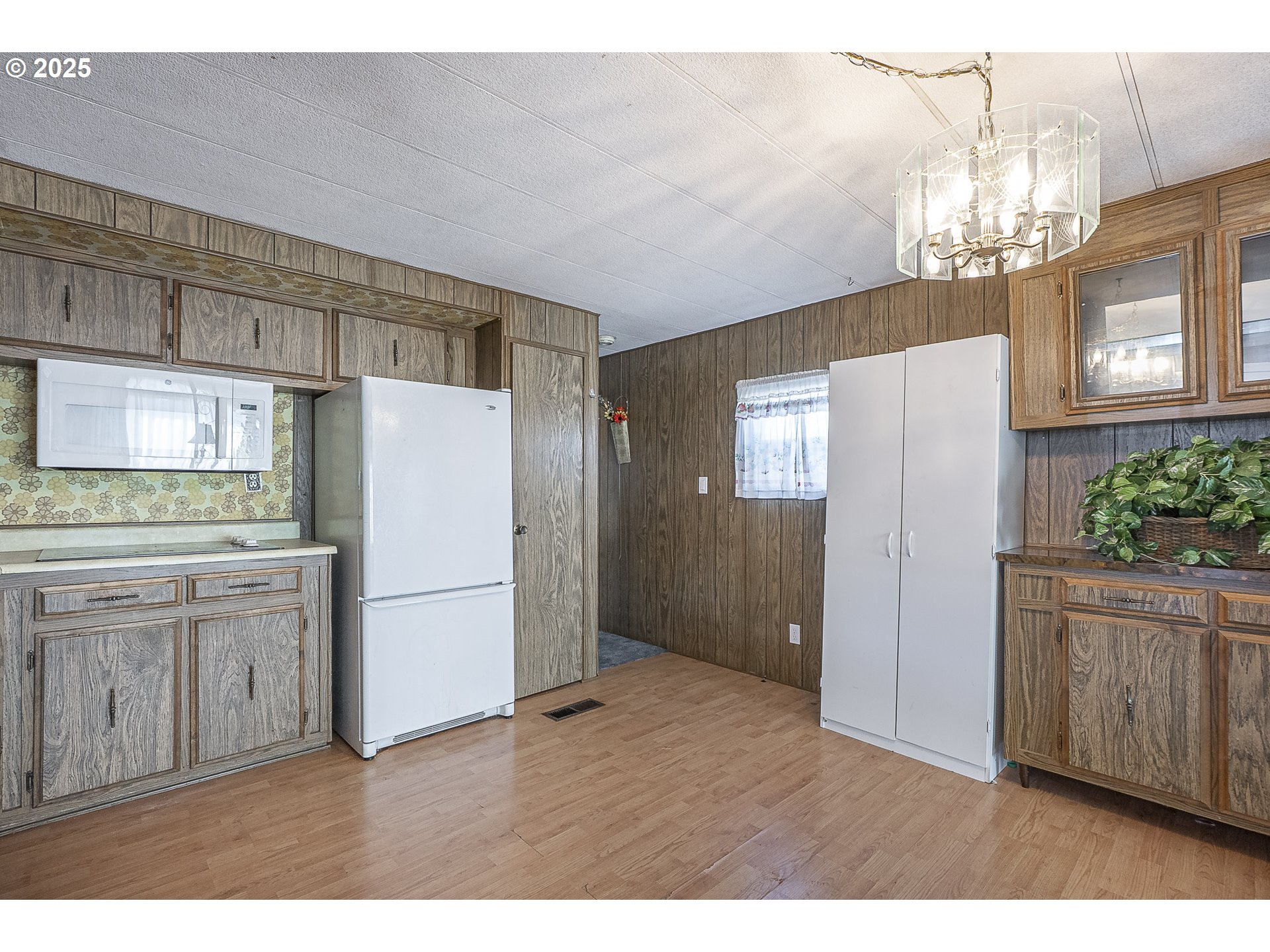 2150 Laura Street, Unit 57 Springfield, OR 97477 - Photo 20 of 23 a kitchen with cabinets and stainless steel appliances