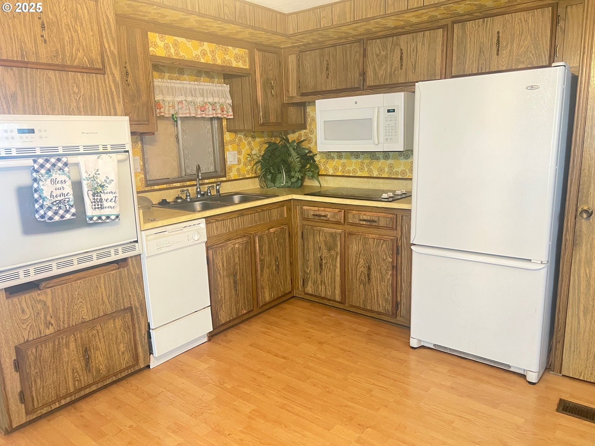 2150 Laura Street, Unit 57 Springfield, OR 97477 - Photo 2 of 23 a white refrigerator freezer sitting in a kitchen