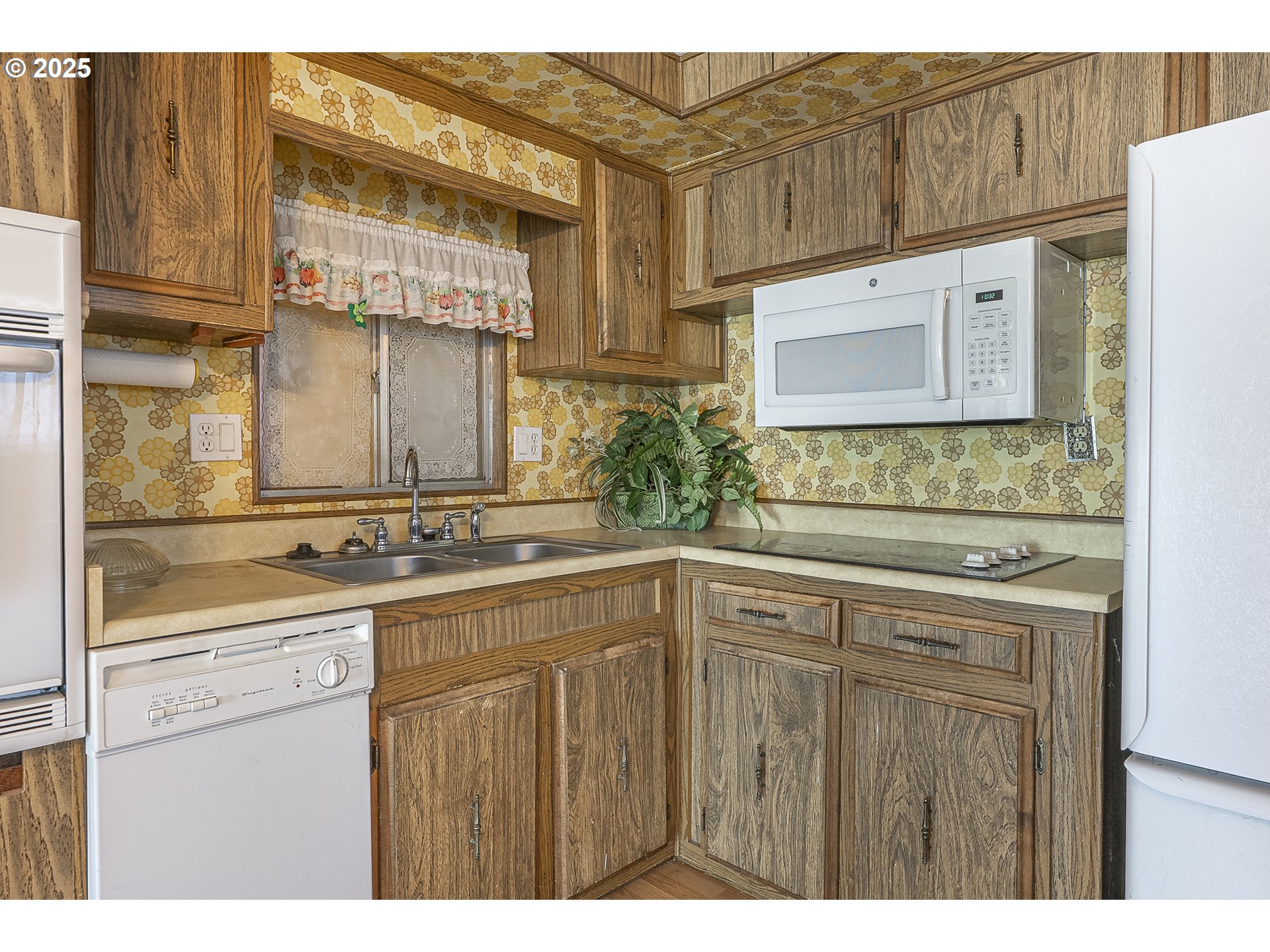 2150 Laura Street, Unit 57 Springfield, OR 97477 - Photo 22 of 23 a kitchen with stainless steel appliances granite countertop a sink and cabinets