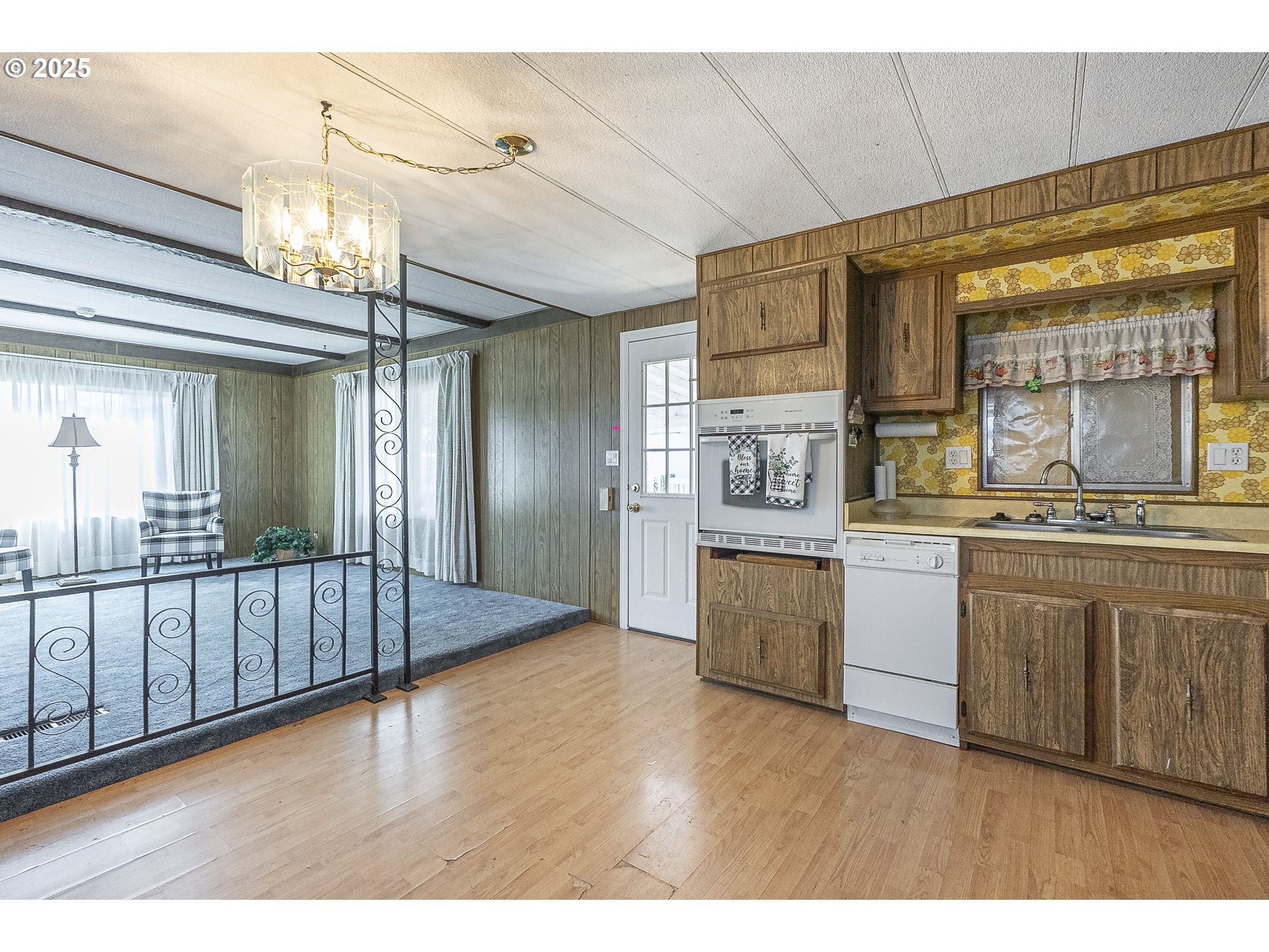 2150 Laura Street, Unit 57 Springfield, OR 97477 - Photo 23 of 23 a open kitchen with stainless steel appliances granite countertop a sink and cabinets