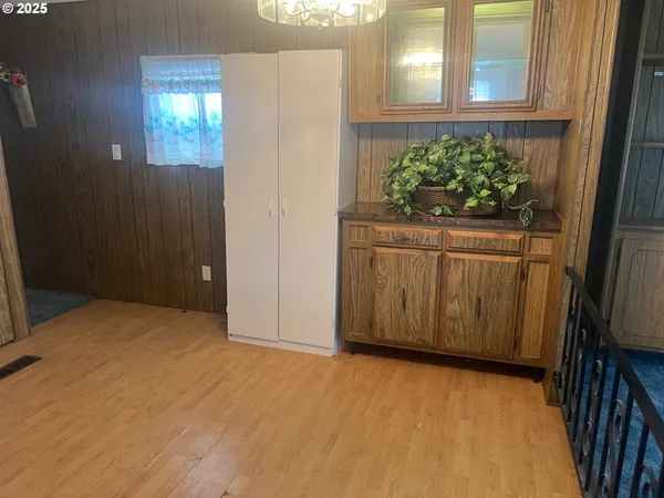 a view of an entryway with wooden floor