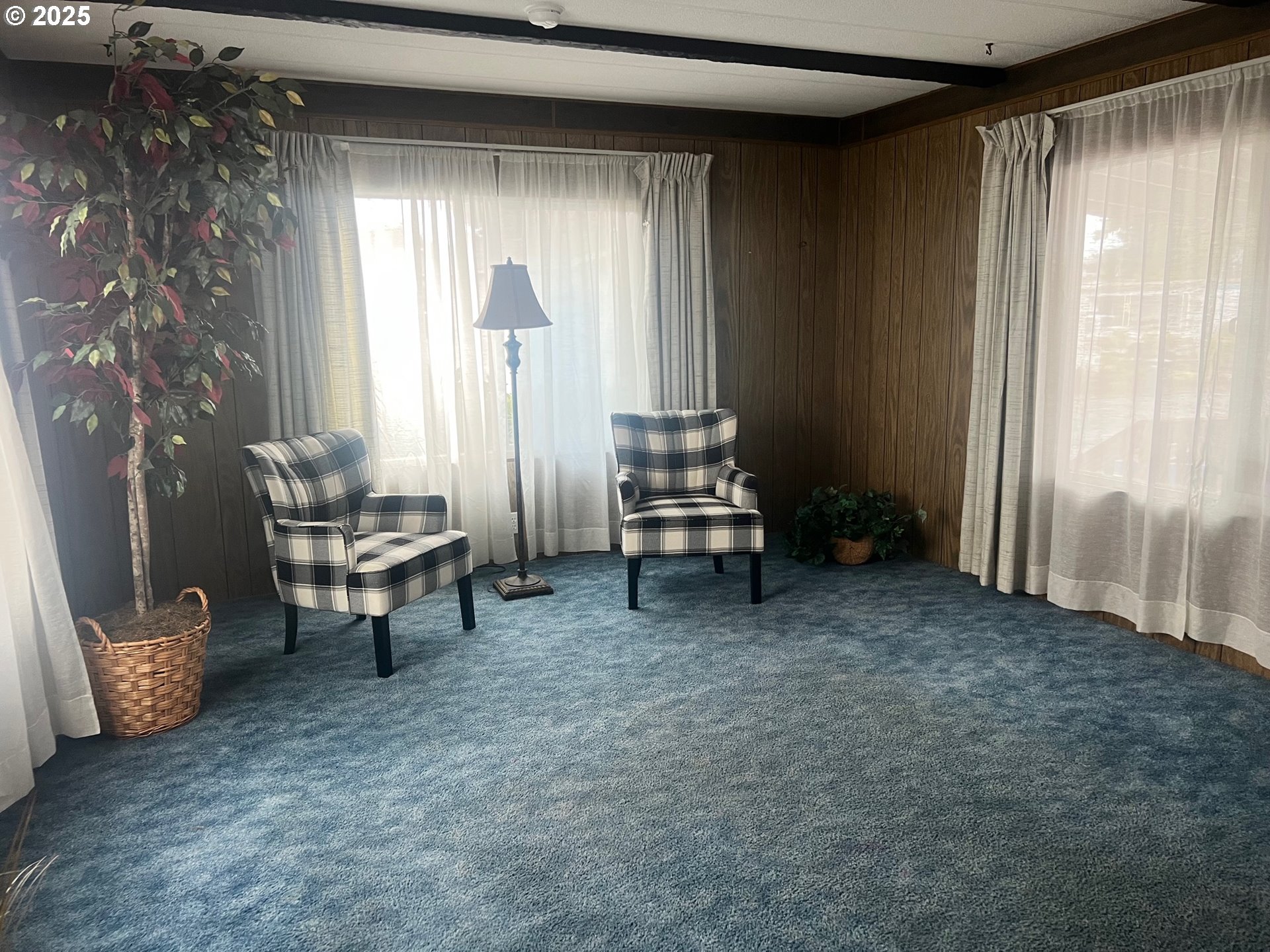 2150 Laura Street, Unit 57 Springfield, OR 97477 - Photo 4 of 23 a view of a room with windows and lounge chair