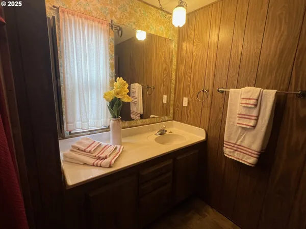 a bathroom with a sink and mirror