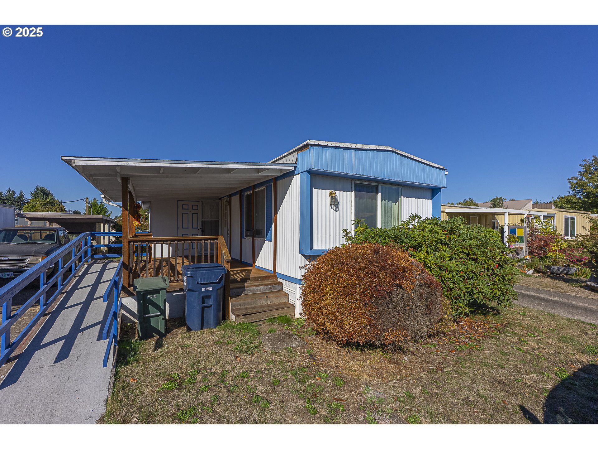 2150 Laura Street, Unit 57 Springfield, OR 97477 - Photo 10 of 23 a view of a house with backyard porch and sitting area