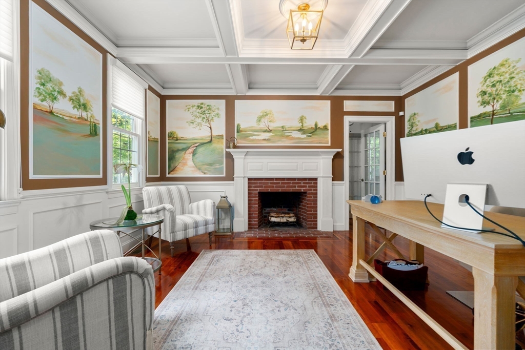 114 Fox Run Road Bolton, MA 01740 - Photo 12 of 37 a living room with furniture a fireplace and a table