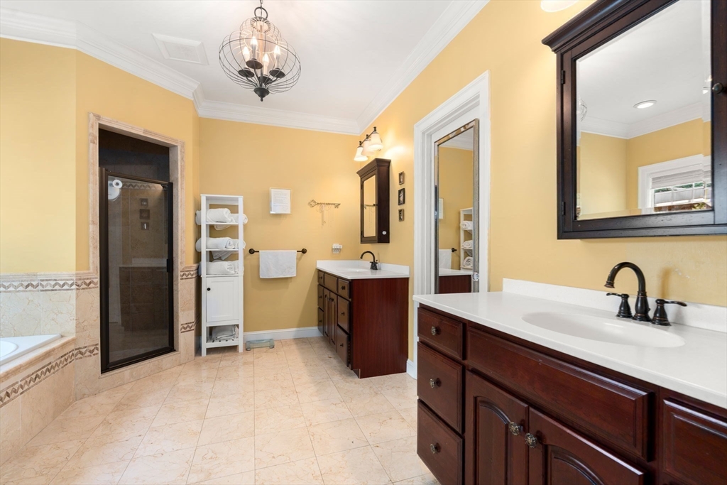 114 Fox Run Road Bolton, MA 01740 - Photo 14 of 37 a spacious bathroom with a sink double vanity and a mirror