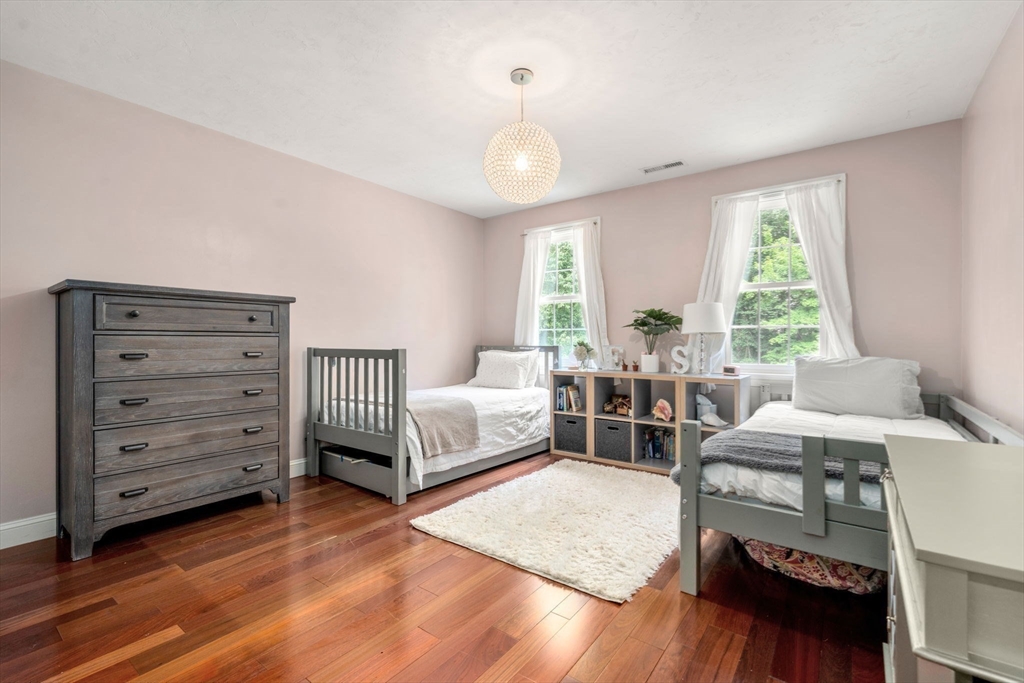 114 Fox Run Road Bolton, MA 01740 - Photo 21 of 37 a bedroom with furniture and a large window