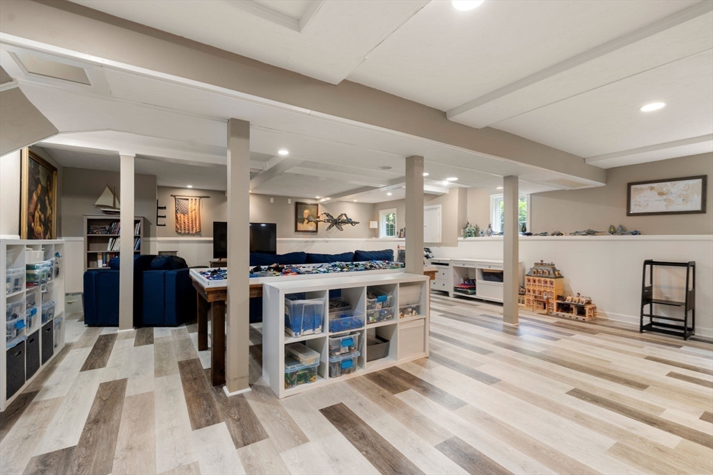 114 Fox Run Road Bolton, MA 01740 - Photo 27 of 37 a large white kitchen with stainless steel appliances kitchen island granite countertop a refrigerator and a stove top oven
