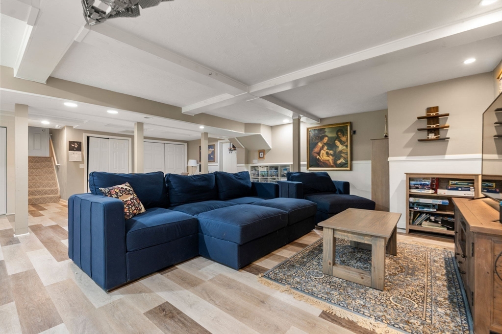 114 Fox Run Road Bolton, MA 01740 - Photo 28 of 37 a living room with furniture and a fireplace