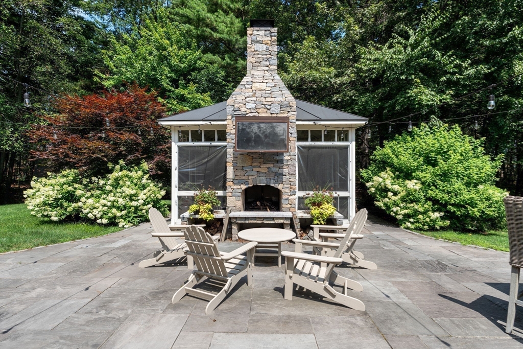 114 Fox Run Road Bolton, MA 01740 - Photo 32 of 37 a view of a house with sitting area and garden