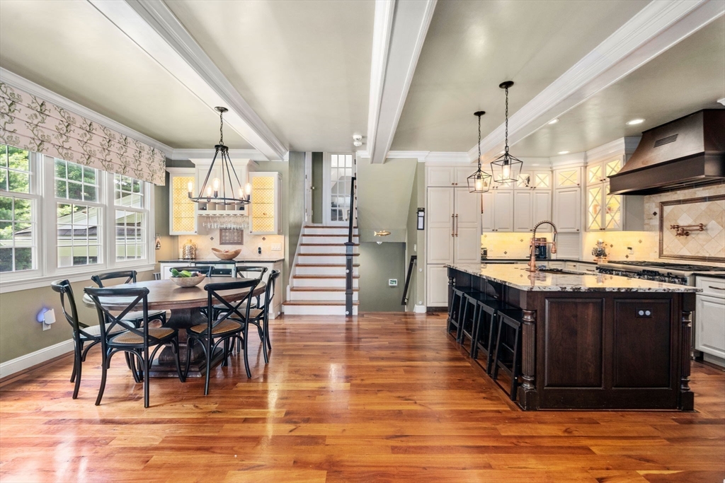 114 Fox Run Road Bolton, MA 01740 - Photo 7 of 37 a large kitchen with stainless steel appliances granite countertop a dining table chairs and granite counter tops