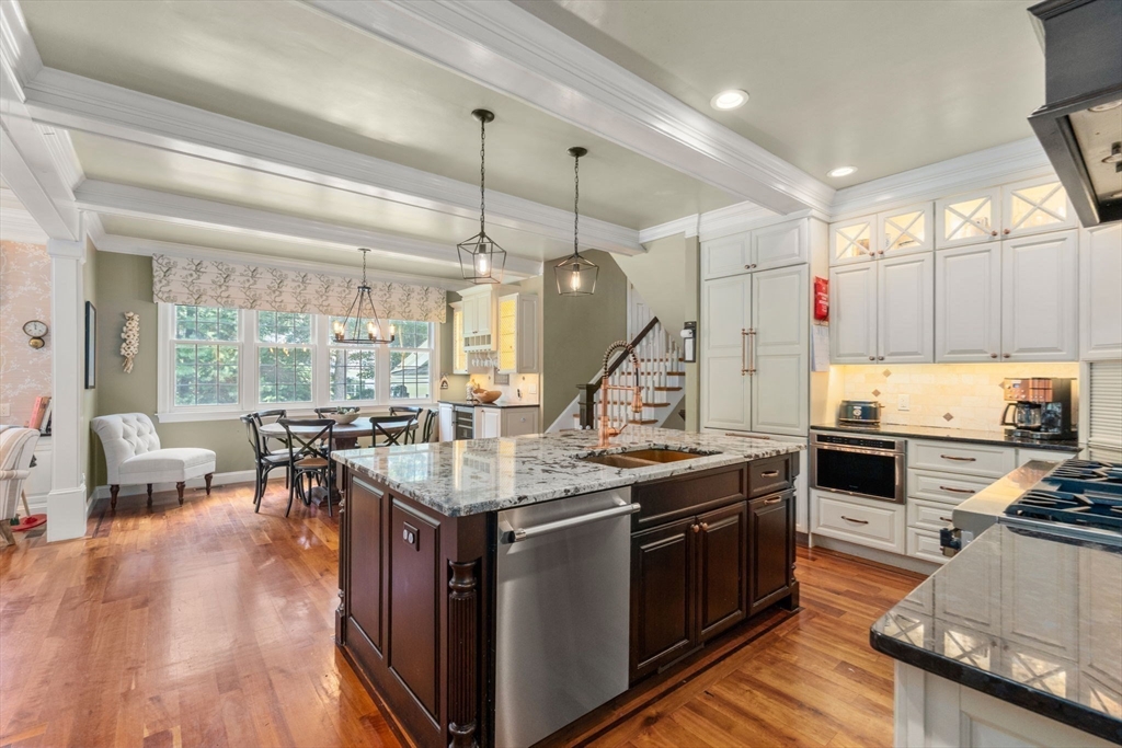 114 Fox Run Road Bolton, MA 01740 - Photo 9 of 37 a open kitchen with stainless steel appliances granite countertop a stove and chairs
