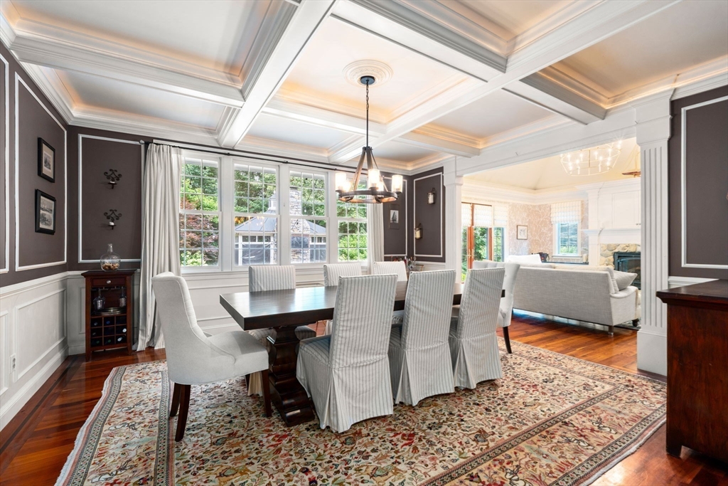 114 Fox Run Road Bolton, MA 01740 - Photo 10 of 37 a dining room with furniture a rug a rug and a chandelier