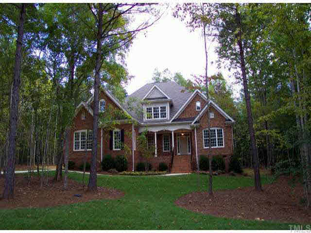 1021 Quiet Ridge Circle Raleigh, NC 27614 - Photo 1 of 9 a front view of a house with a garden