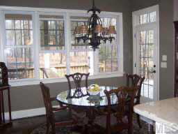 1021 Quiet Ridge Circle Raleigh, NC 27614 - Photo 5 of 9 a view of a dining room with furniture and chandelier