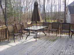 1021 Quiet Ridge Circle Raleigh, NC 27614 - Photo 8 of 9 a view of a patio with a table and chairs