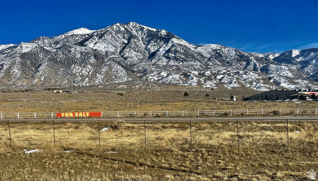 View of mountain background featuring rural landscape