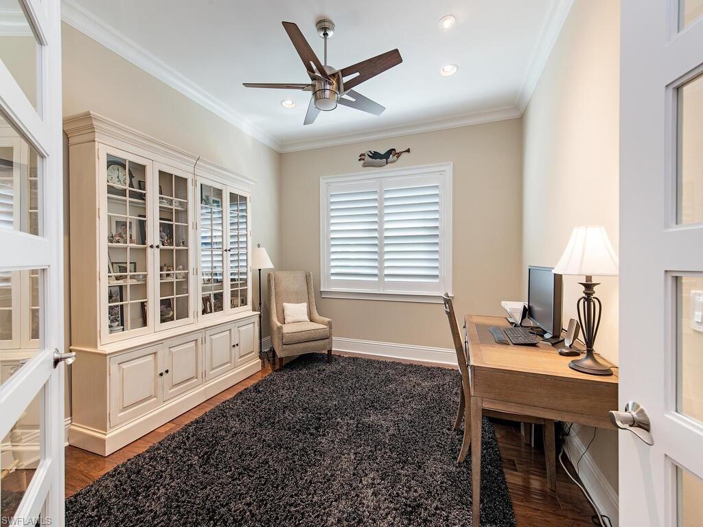 6445 Pembroke Way Naples, FL 34113 - Photo 12 of 40 a view of a workspace with furniture and a window