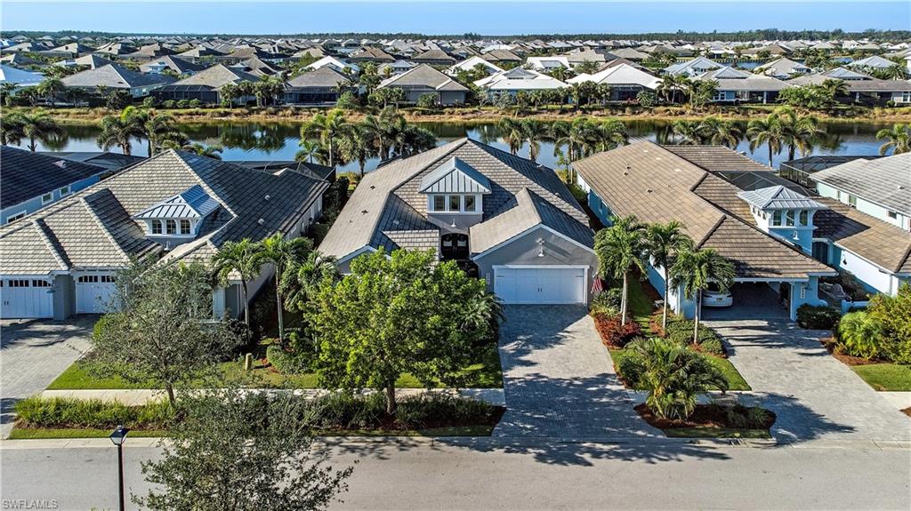 6445 Pembroke Way Naples, FL 34113 - Photo 2 of 40 an aerial view of a house with a garden