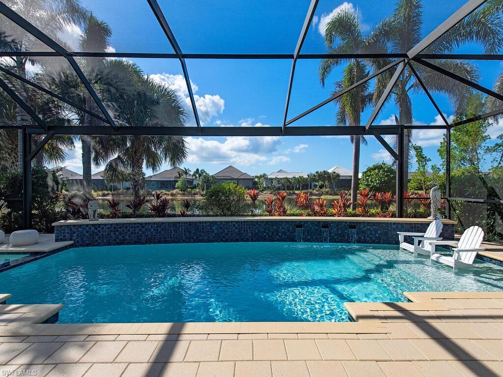 6445 Pembroke Way Naples, FL 34113 - Photo 22 of 40 a view of outdoor space with swimming pool