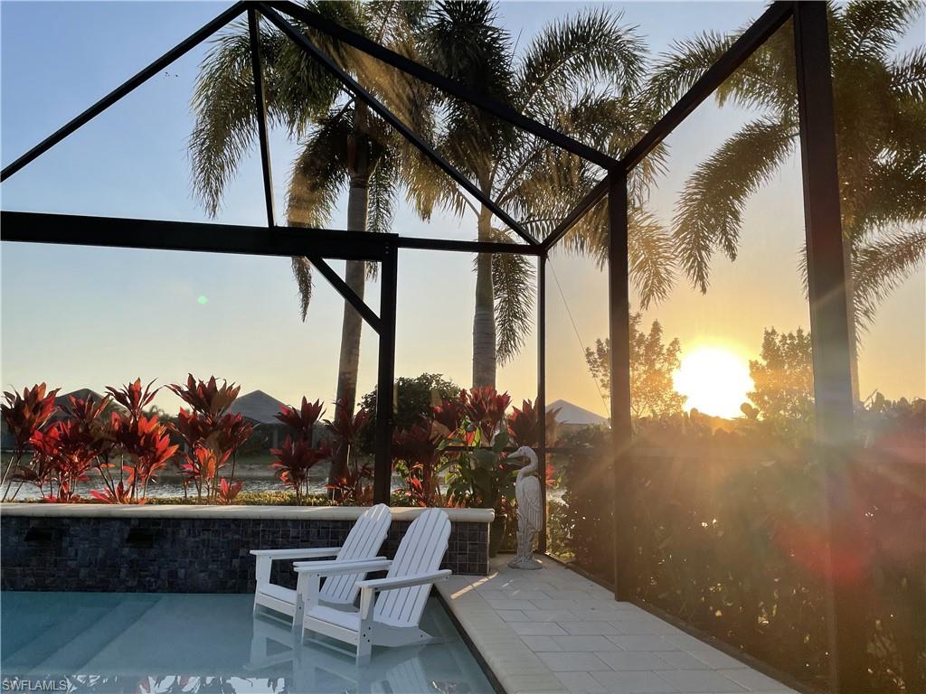 6445 Pembroke Way Naples, FL 34113 - Photo 26 of 40 a view of balcony with outdoor seating and plants
