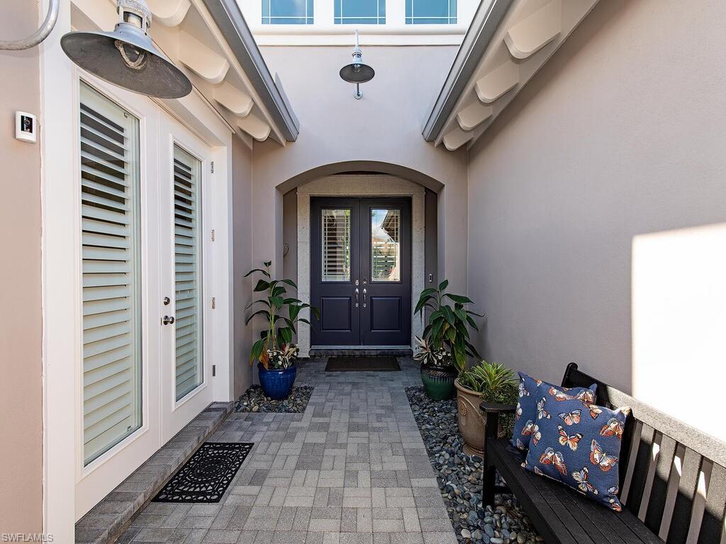 6445 Pembroke Way Naples, FL 34113 - Photo 4 of 40 a view of entryway with a front door