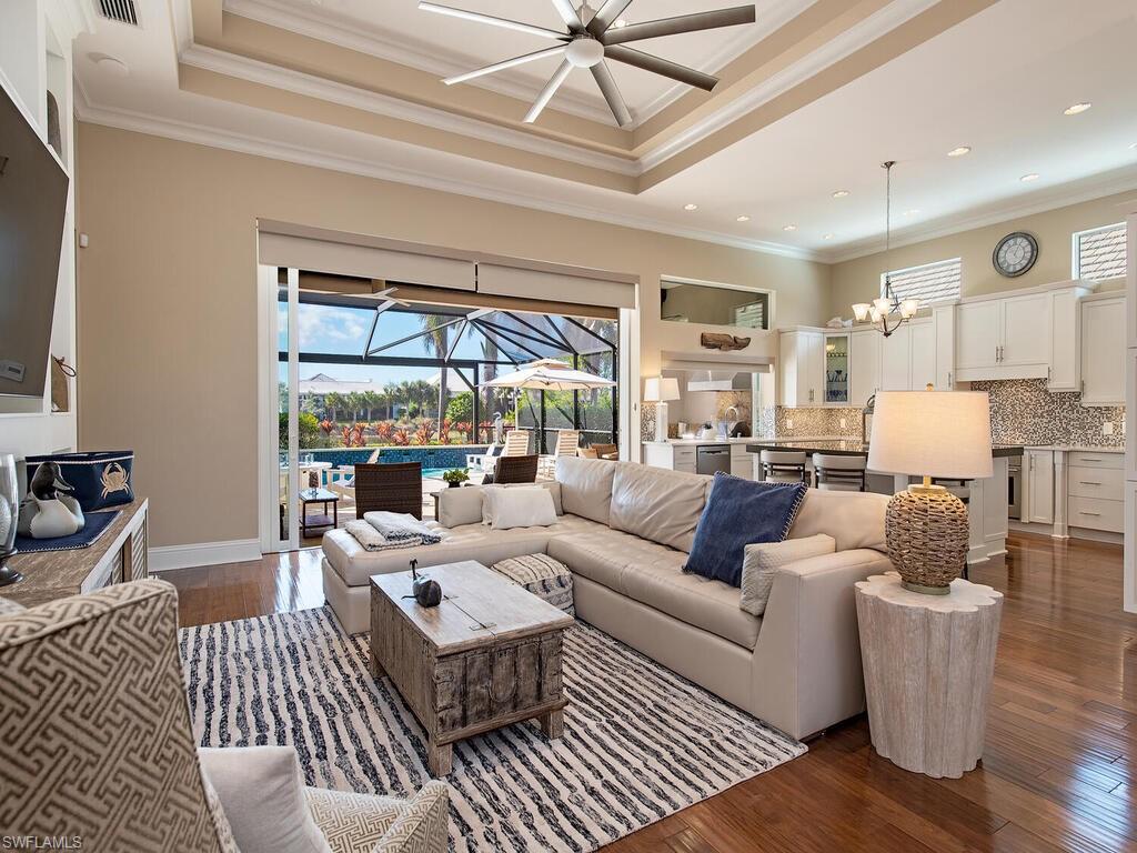 6445 Pembroke Way Naples, FL 34113 - Photo 5 of 40 a living room with furniture and a large window