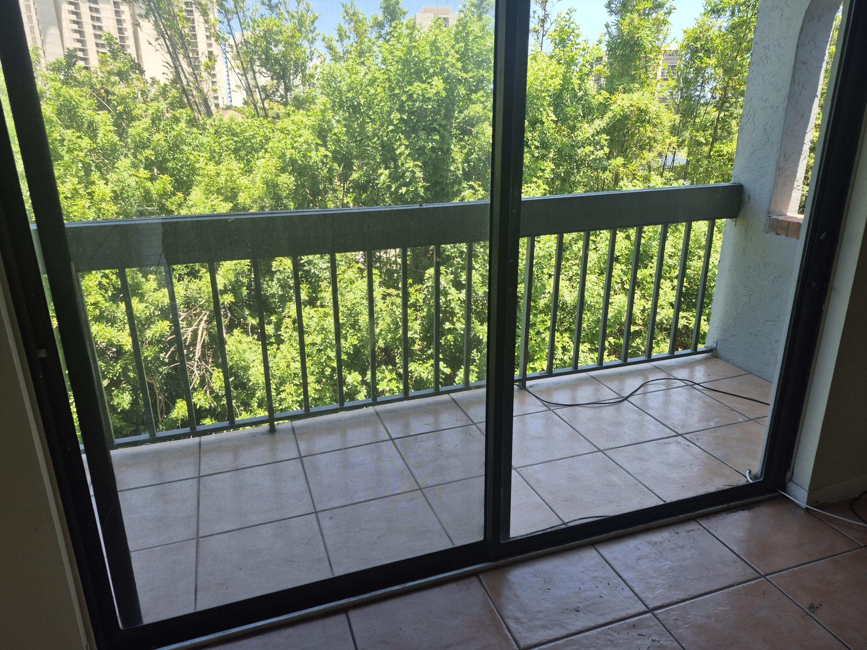 2050 North Congress Avenue, Unit 407 West Palm Beach, FL 33401 - Photo 12 of 16 a view of a porch