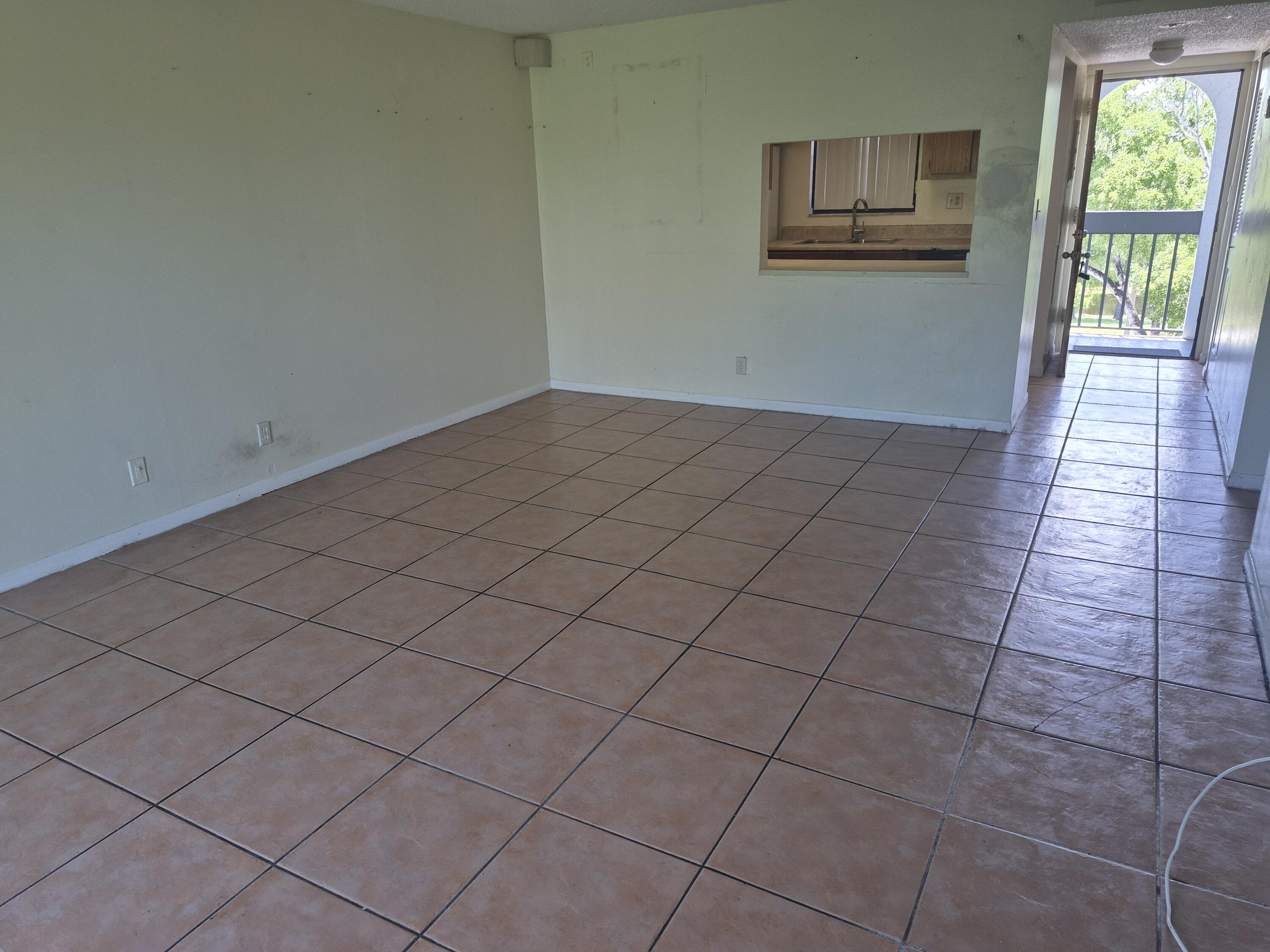 2050 North Congress Avenue, Unit 407 West Palm Beach, FL 33401 - Photo 13 of 16 an empty room with windows