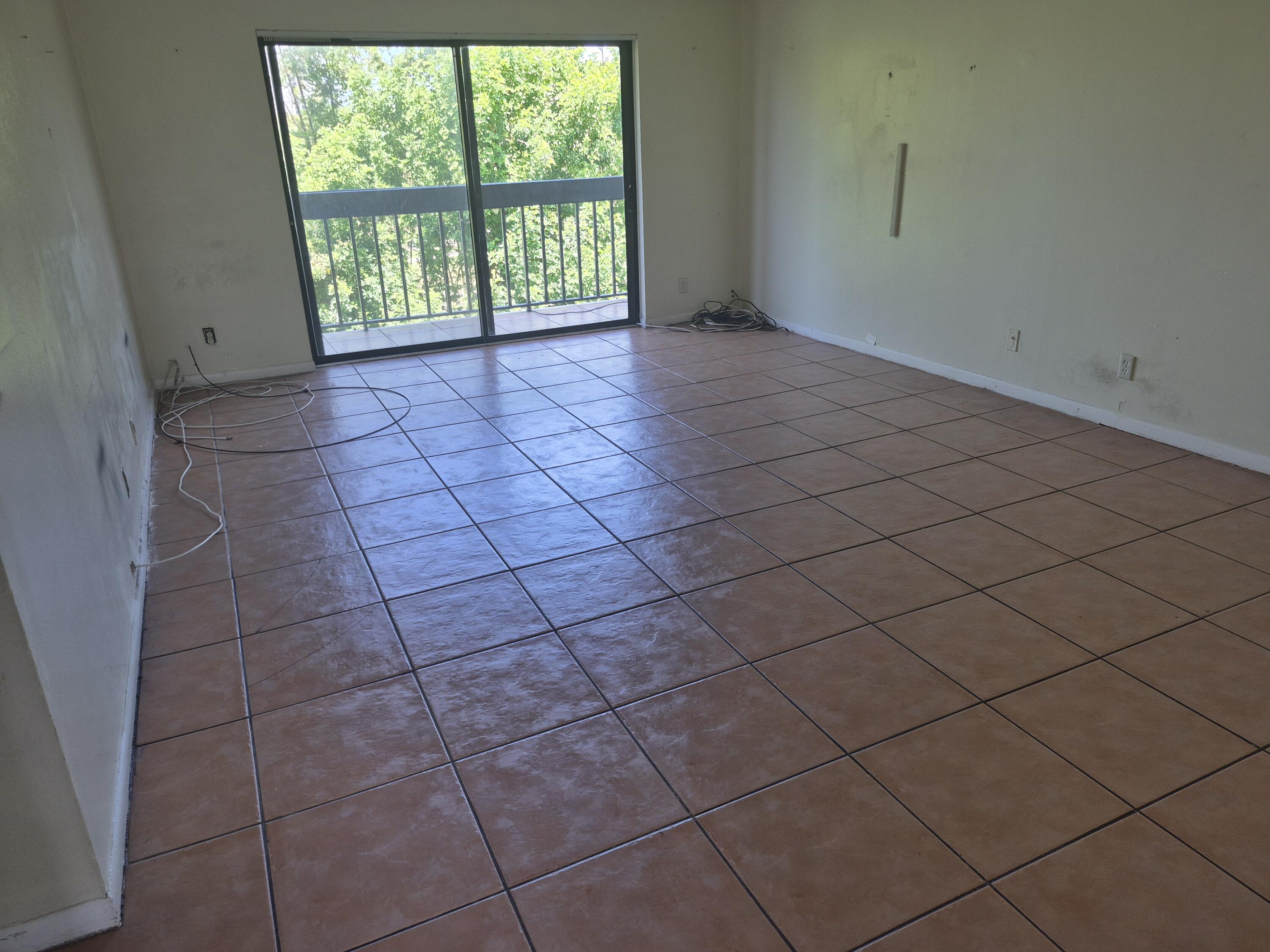 2050 North Congress Avenue, Unit 407 West Palm Beach, FL 33401 - Photo 14 of 16 an empty room with a window