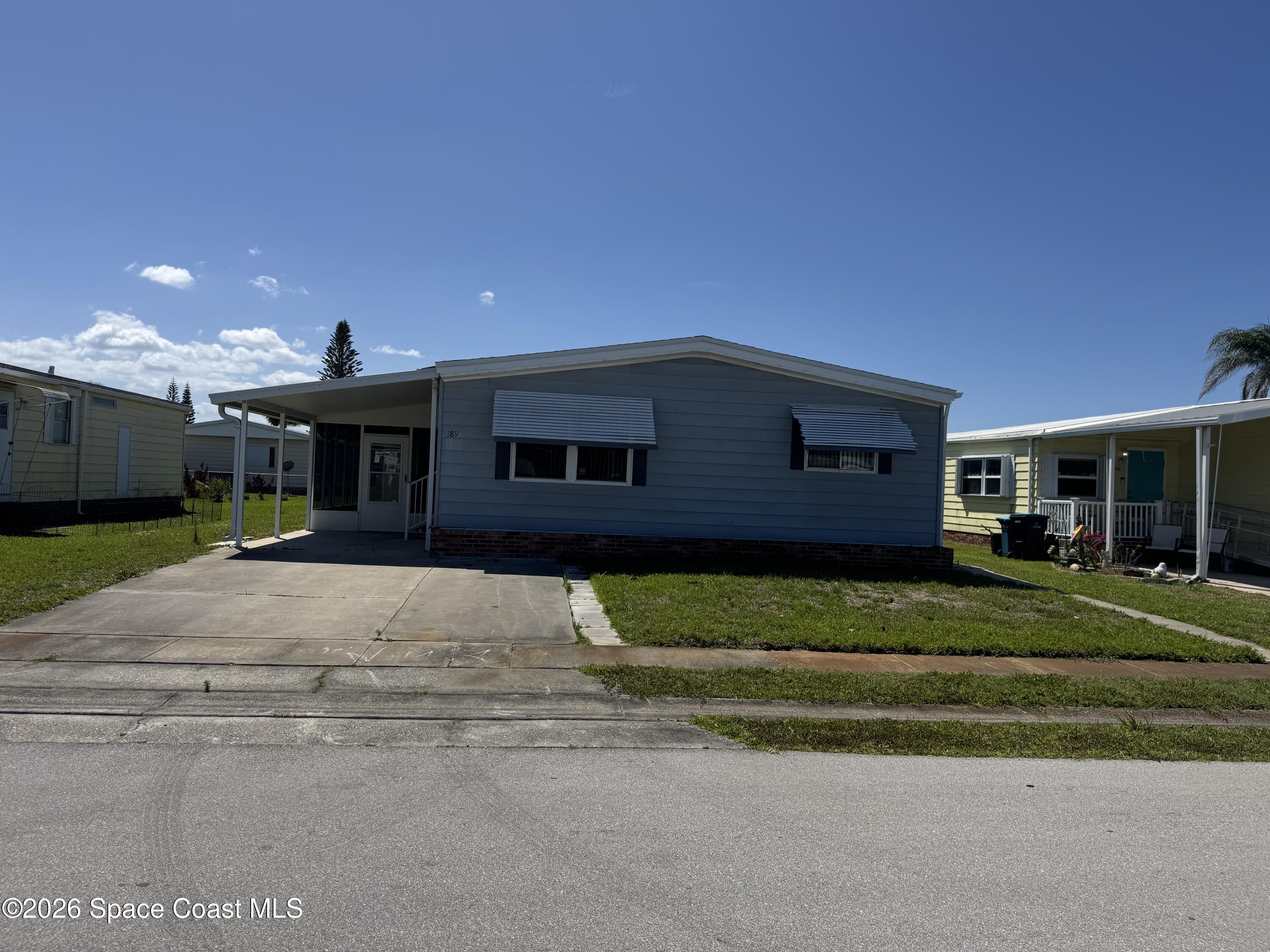 1894 Coco Plum Street Northeast Palm Bay, FL 32905 - Photo 1 of 27 Front of Home