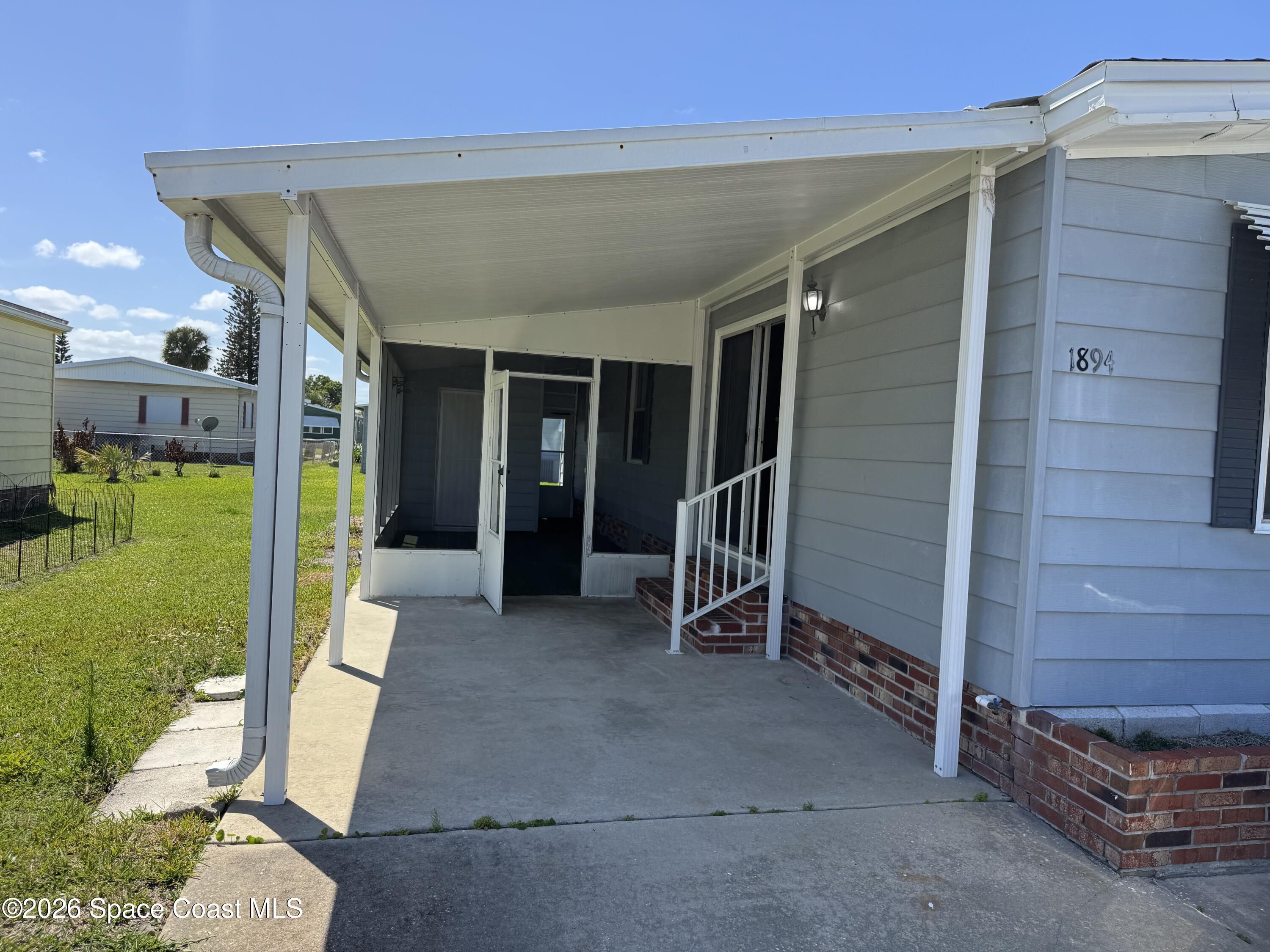 1894 Coco Plum Street Northeast Palm Bay, FL 32905 - Photo 23 of 27 Carport