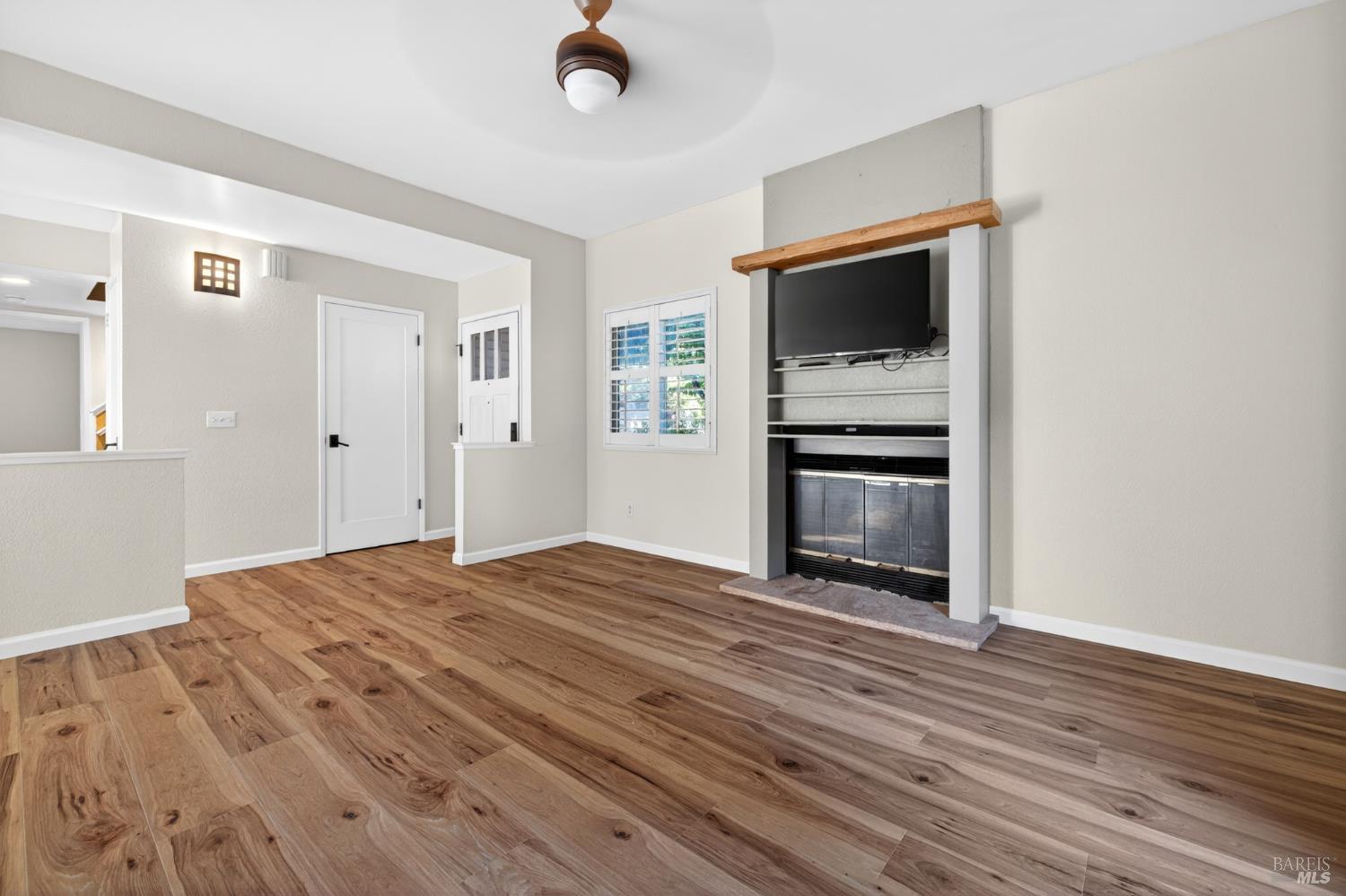 2757 Lakeview Drive Santa Rosa, CA 95405 - Photo 11 of 54 a view of an empty room with a fireplace and a window