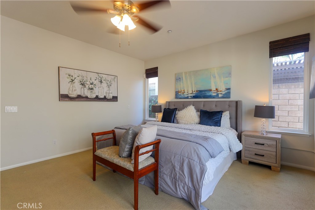 327 Tomko Way Placentia, CA 92870 - Photo 25 of 47 a bedroom with a bed and a chandelier