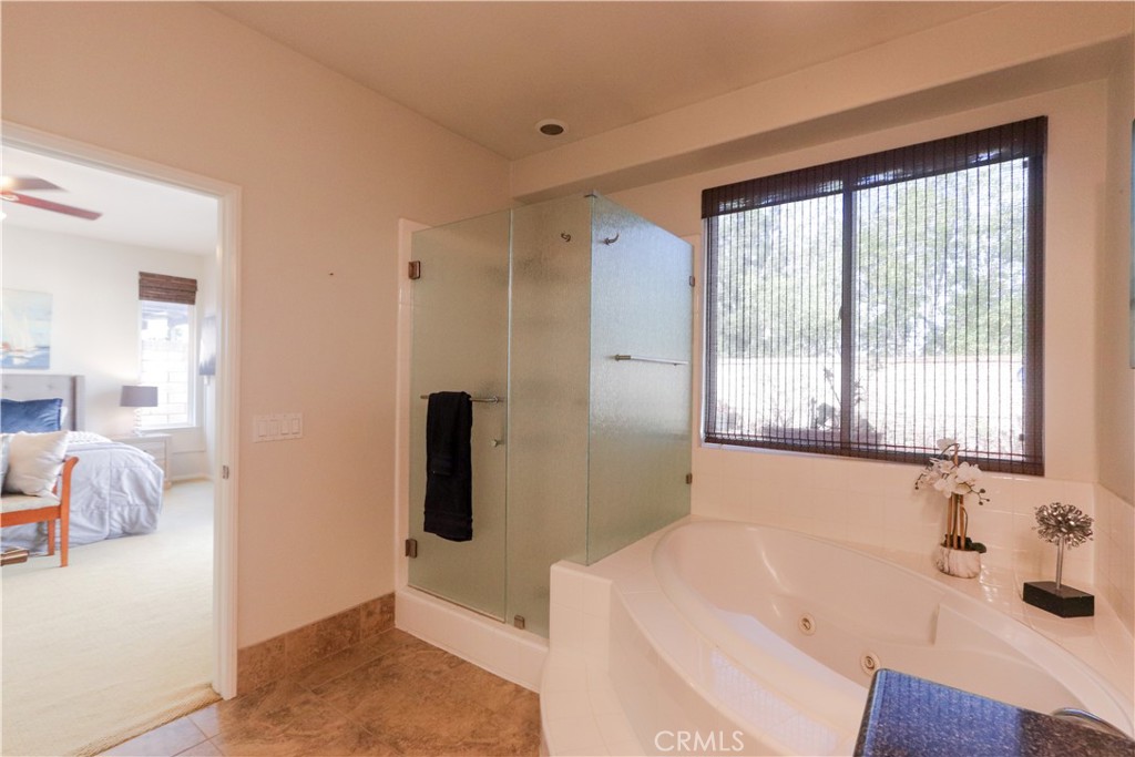 327 Tomko Way Placentia, CA 92870 - Photo 28 of 47 a bathroom with a tub sink and mirror
