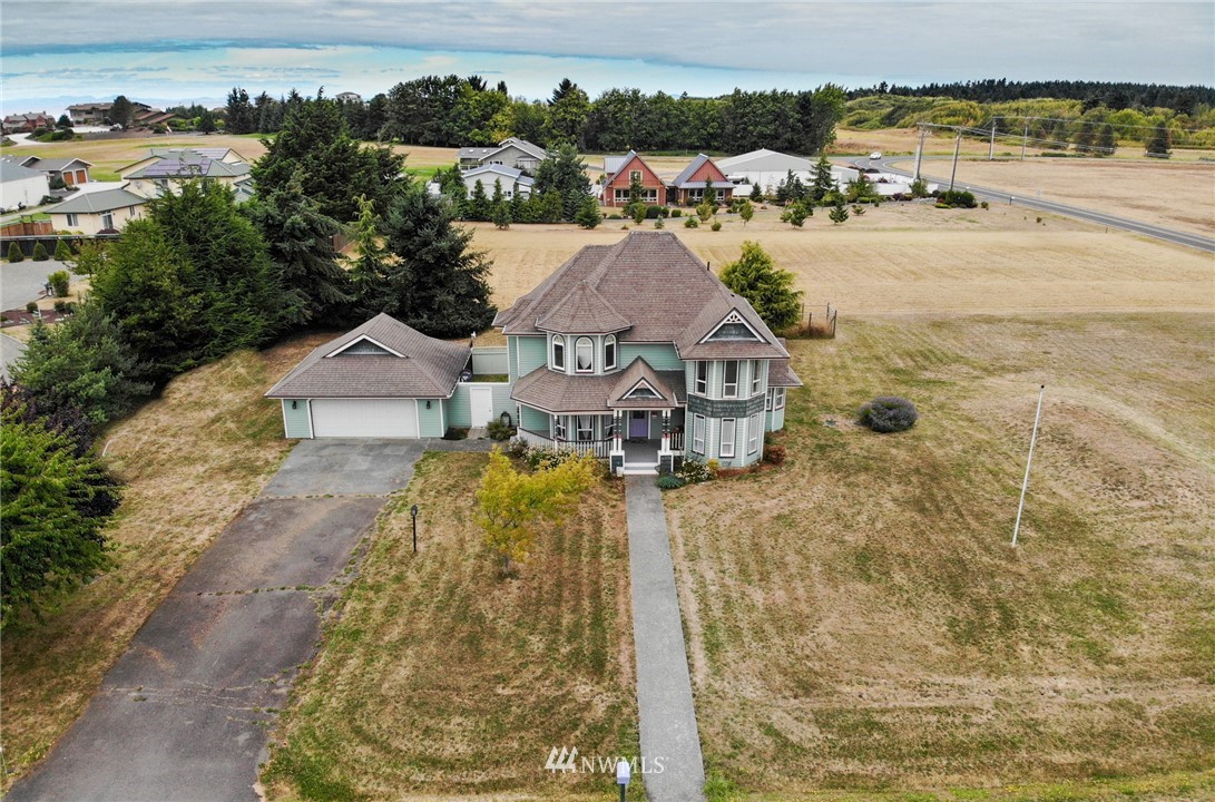 52 Greywolf Road Sequim, WA 98382 - Photo 2 of 31 an aerial view of a house with a ocean view