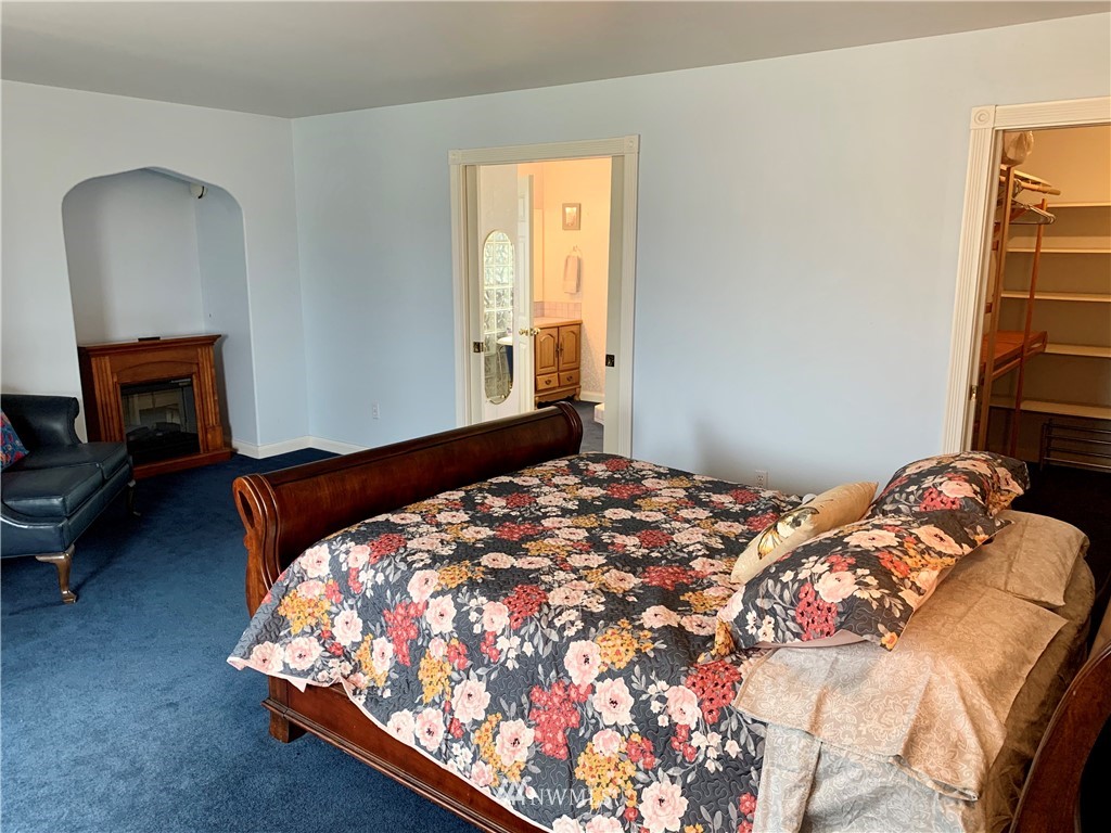 52 Greywolf Road Sequim, WA 98382 - Photo 17 of 31 a bedroom with a bed and a window