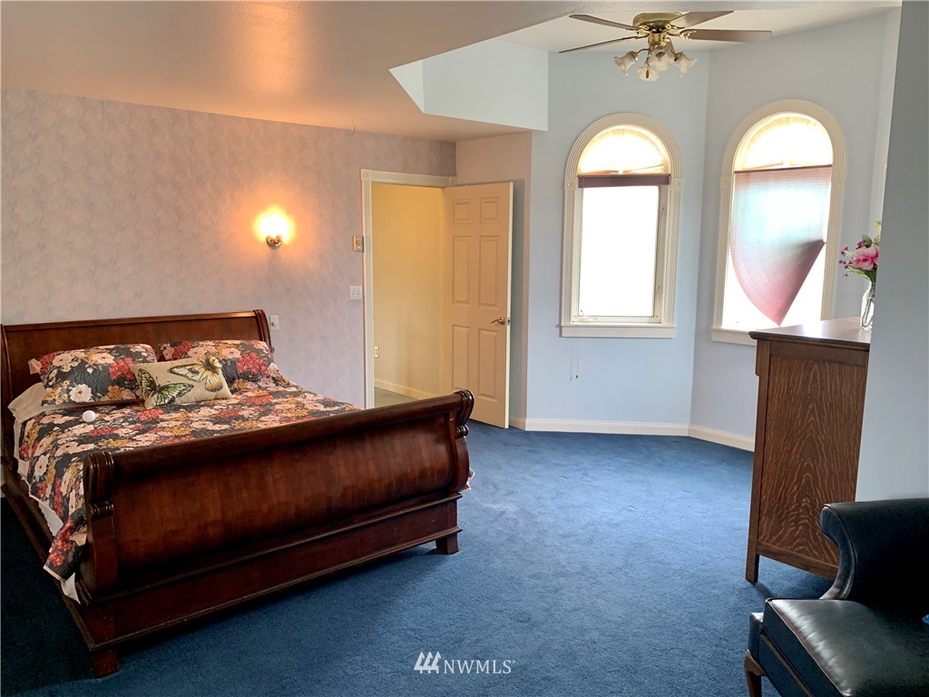 52 Greywolf Road Sequim, WA 98382 - Photo 18 of 31 a bedroom with a bed and window