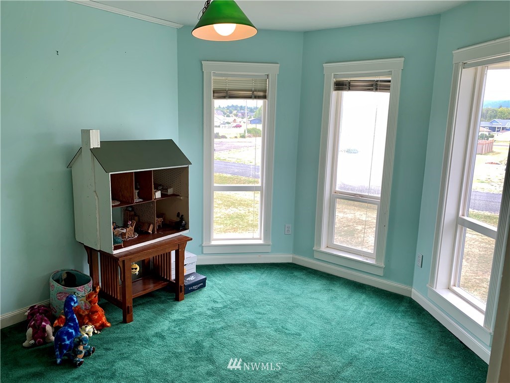 52 Greywolf Road Sequim, WA 98382 - Photo 21 of 31 a living room with furniture and a flat screen tv