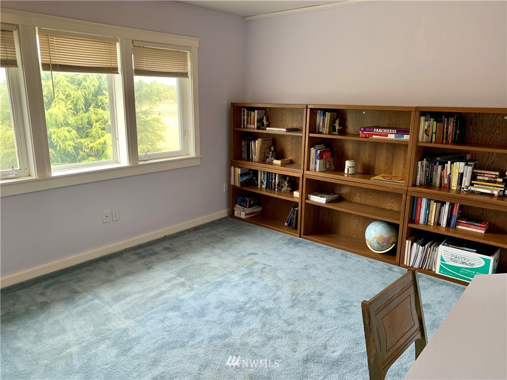 52 Greywolf Road Sequim, WA 98382 - Photo 22 of 31 a view of workspace with lounge chair and cabinet