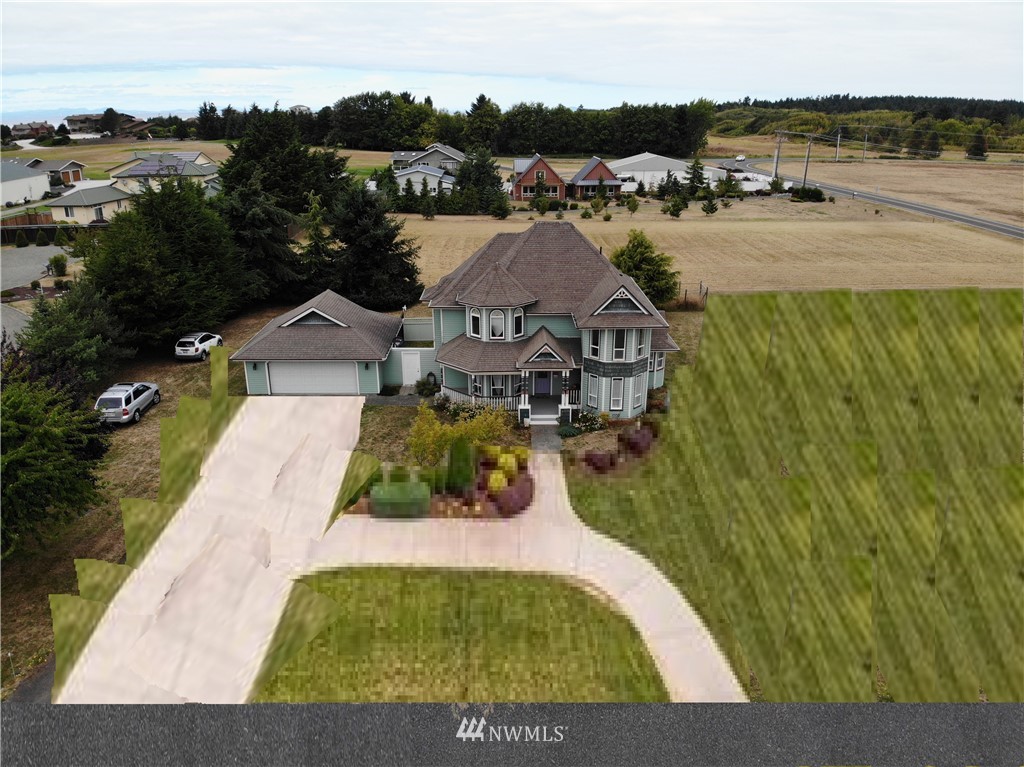 52 Greywolf Road Sequim, WA 98382 - Photo 29 of 31 a view of a swimming pool and lounge chair