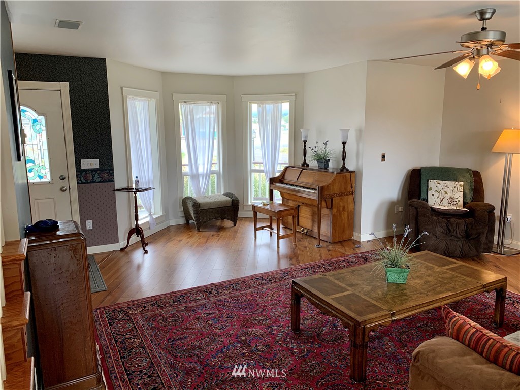 52 Greywolf Road Sequim, WA 98382 - Photo 5 of 31 a living room with furniture and wooden floor